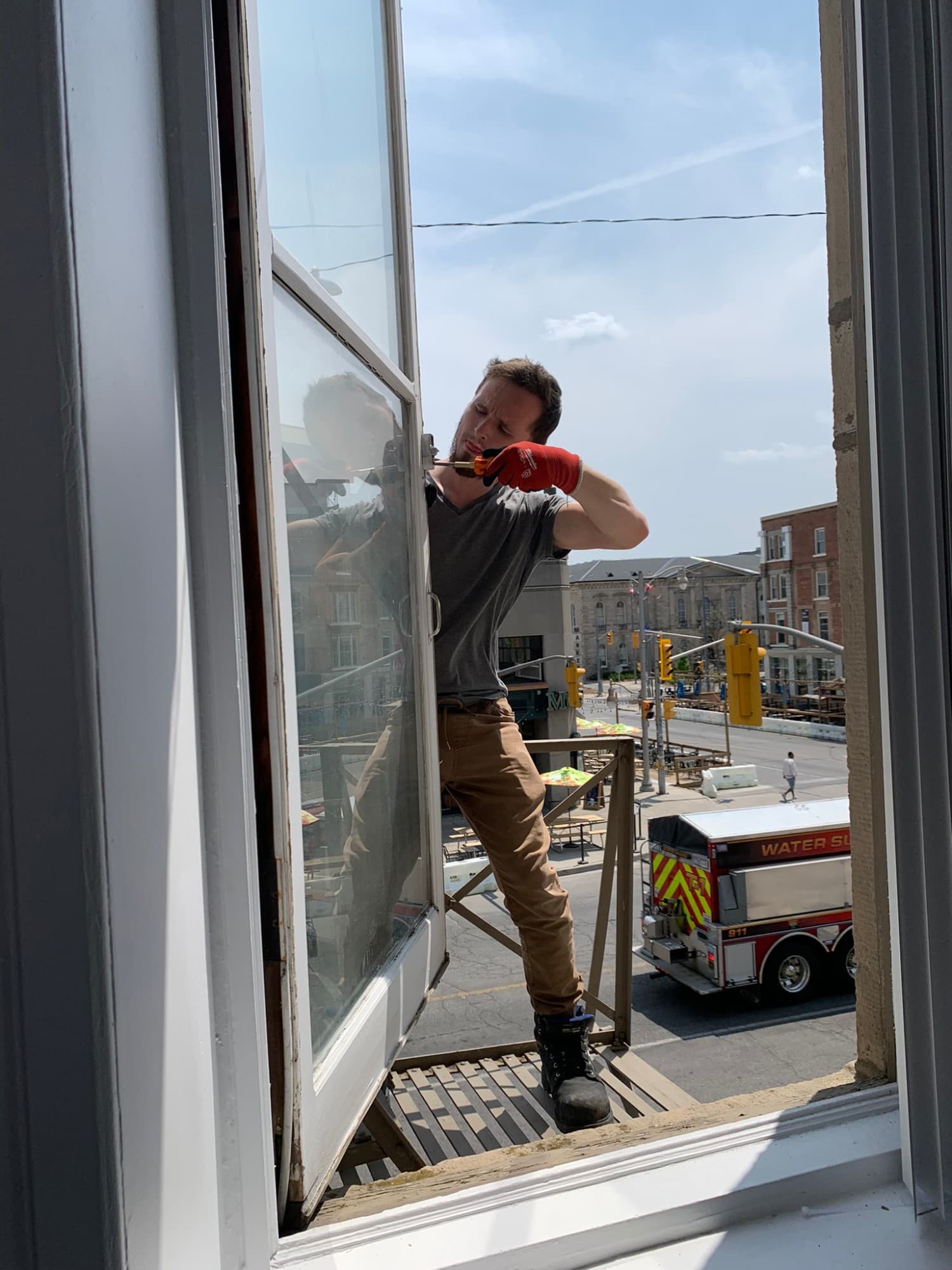Brett from Window Whiz repairing the hardware on a casement window